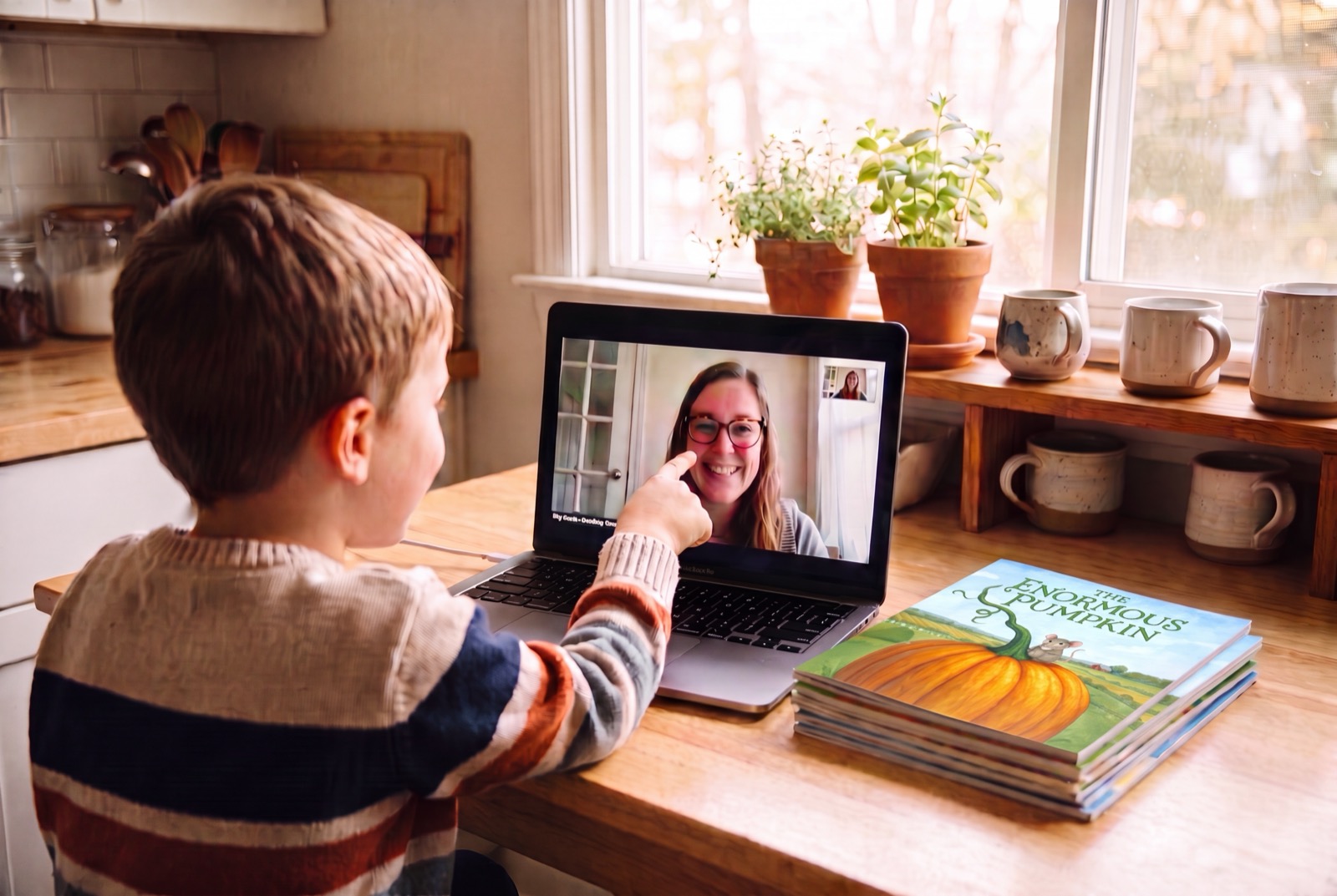 Elementary student in a one-on-one lesson with their teacher on screen